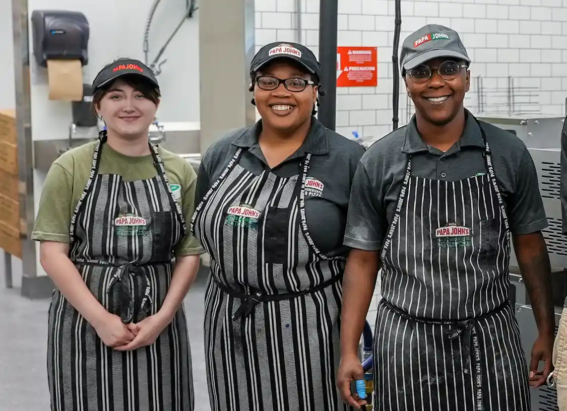 Papa Johns team members standing in kitchen